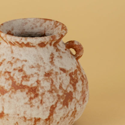 Handmade terracotta ceramic vase in rustic orange white textured finish with round body and twin handles for decor.