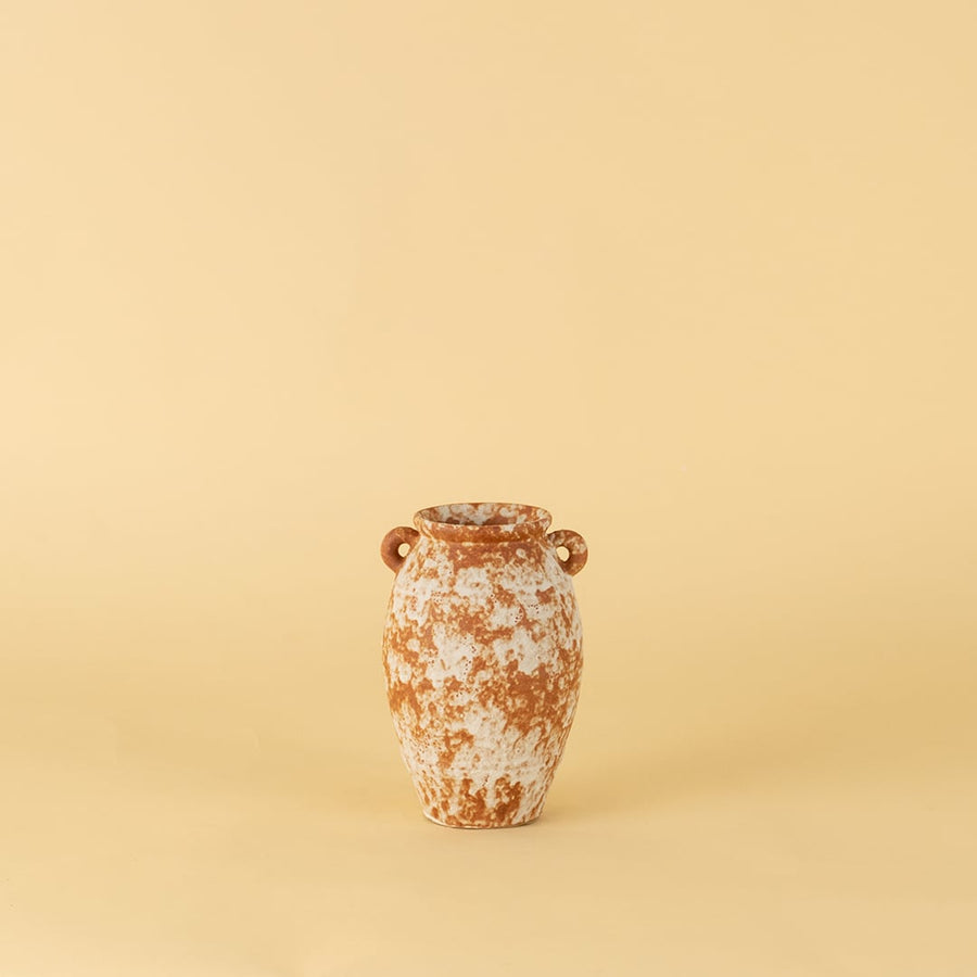 Handcrafted terracotta ceramic vase with dual handles in rustic orange white textured finish for modern home decoration.