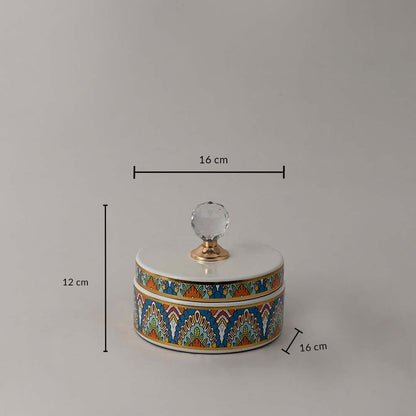 Decorative ceramic jar with artistic design and crystal knob shown with 12 cm height and 16 cm width dimension.