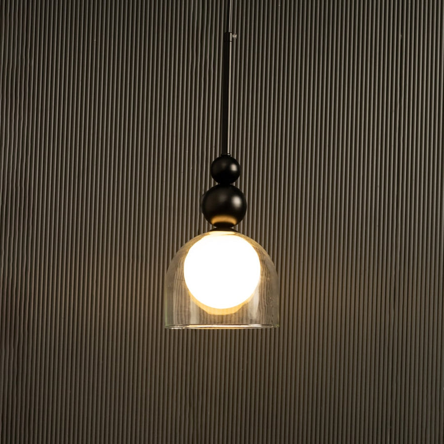 A black and gold pendant with a white globe ideal for LED lighting and clean minimal interior décor enhancing stylish contemporary home aesthetics.