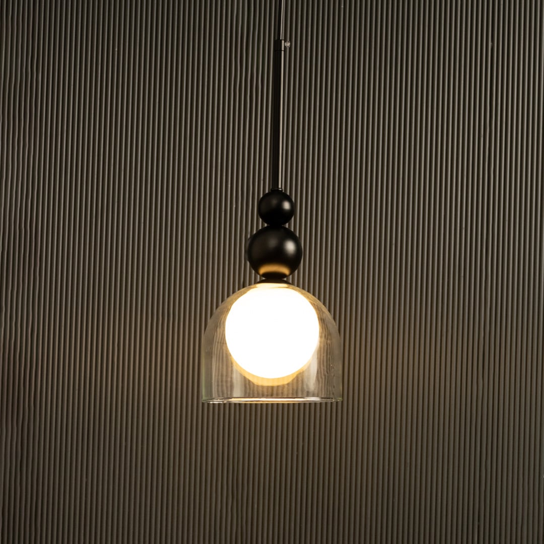 A black and gold pendant with a white globe ideal for LED lighting and clean minimal interior décor enhancing stylish contemporary home aesthetics.