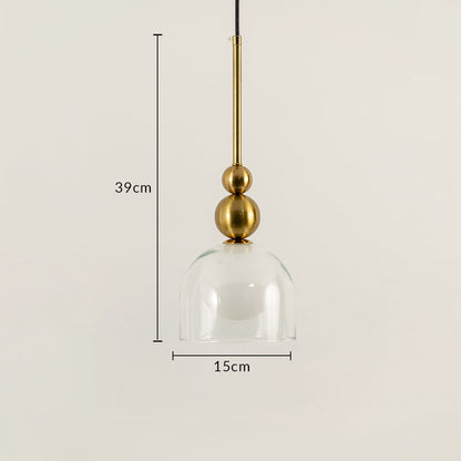 A gold pendant light with clear glass dome shown with 39 cm height and 15 cm width ideal for LED lighting and refined contemporary interior décor styling.