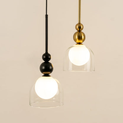 A refined pendant combination with black and gold fittings and white globes in clear shades ideal for modern LED décor and stylish interior lighting.