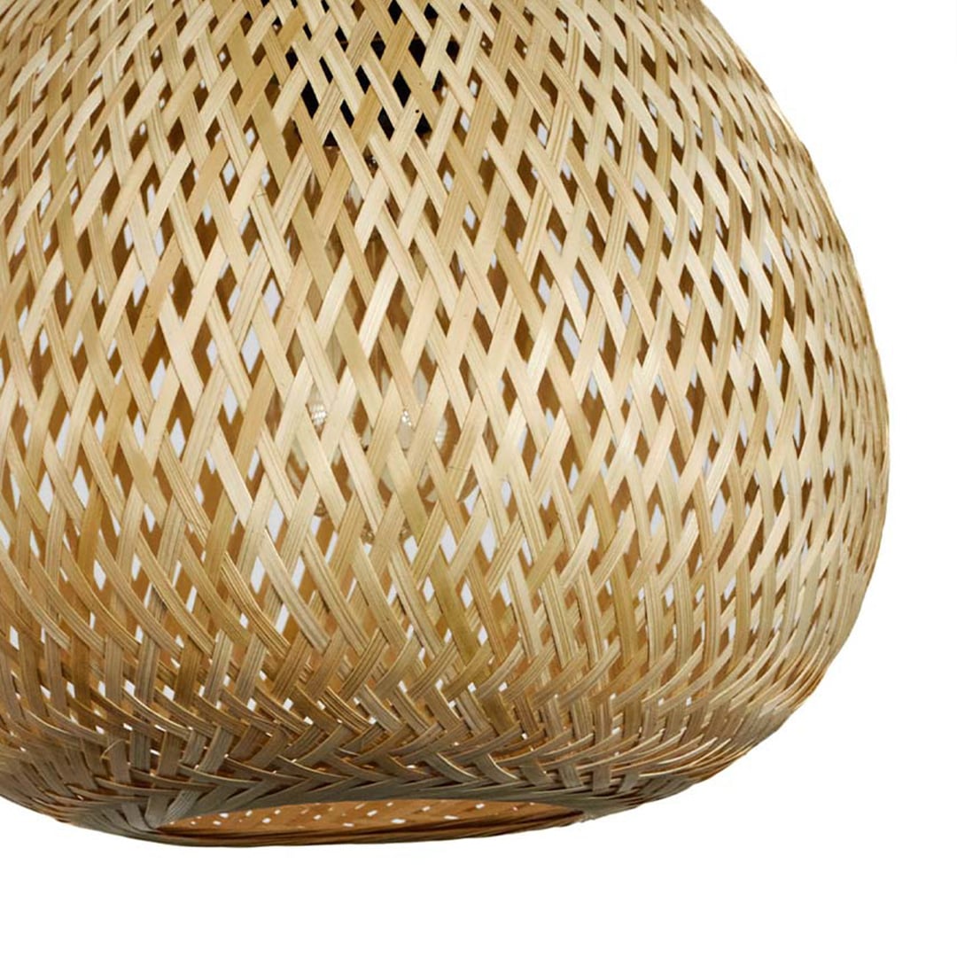 Closeup of rattan pendant light with bulbous woven shade showing handcrafted details for natural home decor.