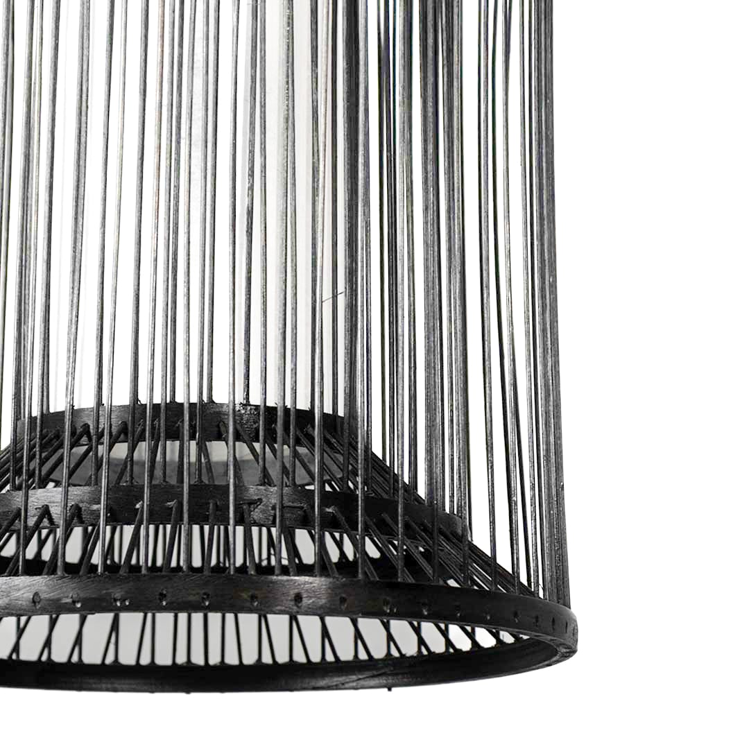 Closeup of cylindrical black wire pendant light showcasing its sleek open-frame detailing and metal craftsmanship.