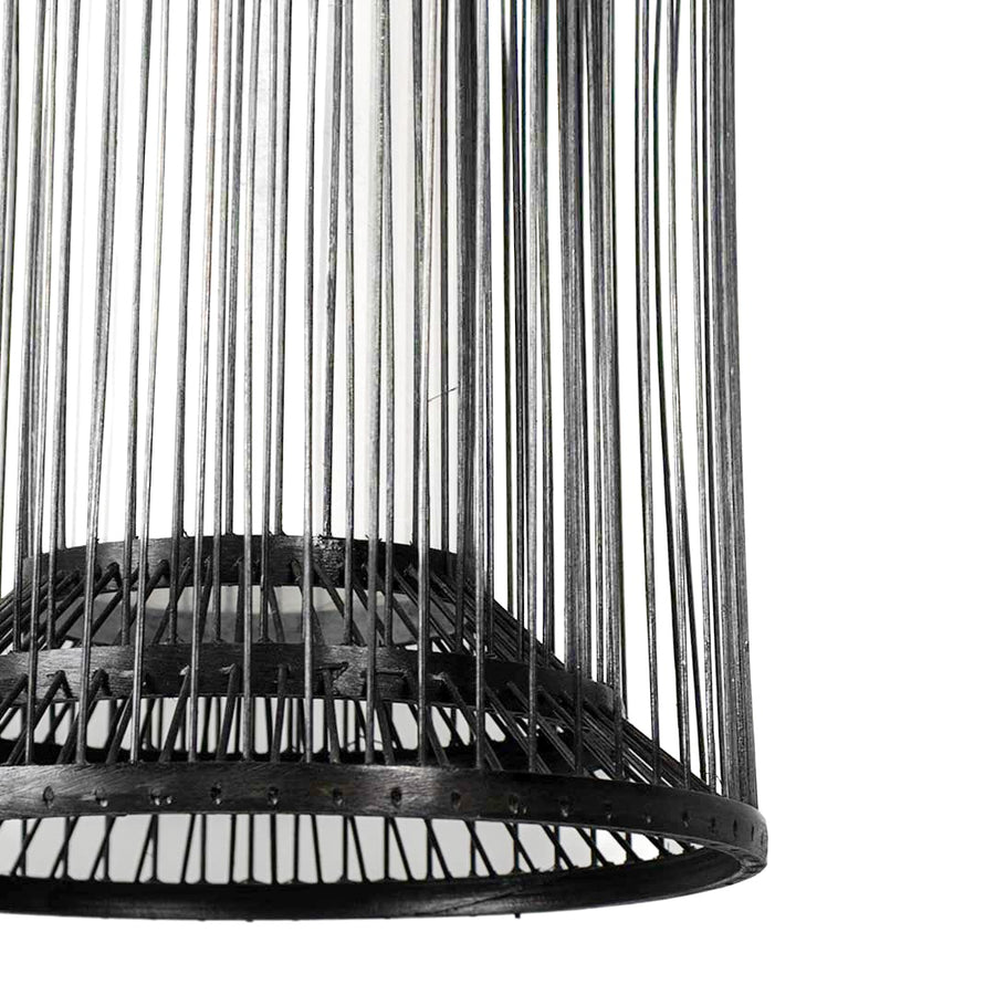 Closeup of cylindrical black wire pendant light showcasing its sleek open-frame detailing and metal craftsmanship.