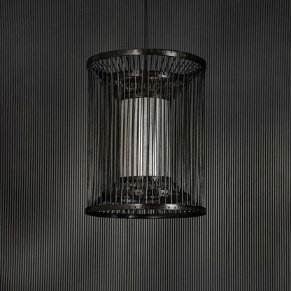 Black wire pendant light on dark background highlighting its minimalist silhouette and detailed metalwork.