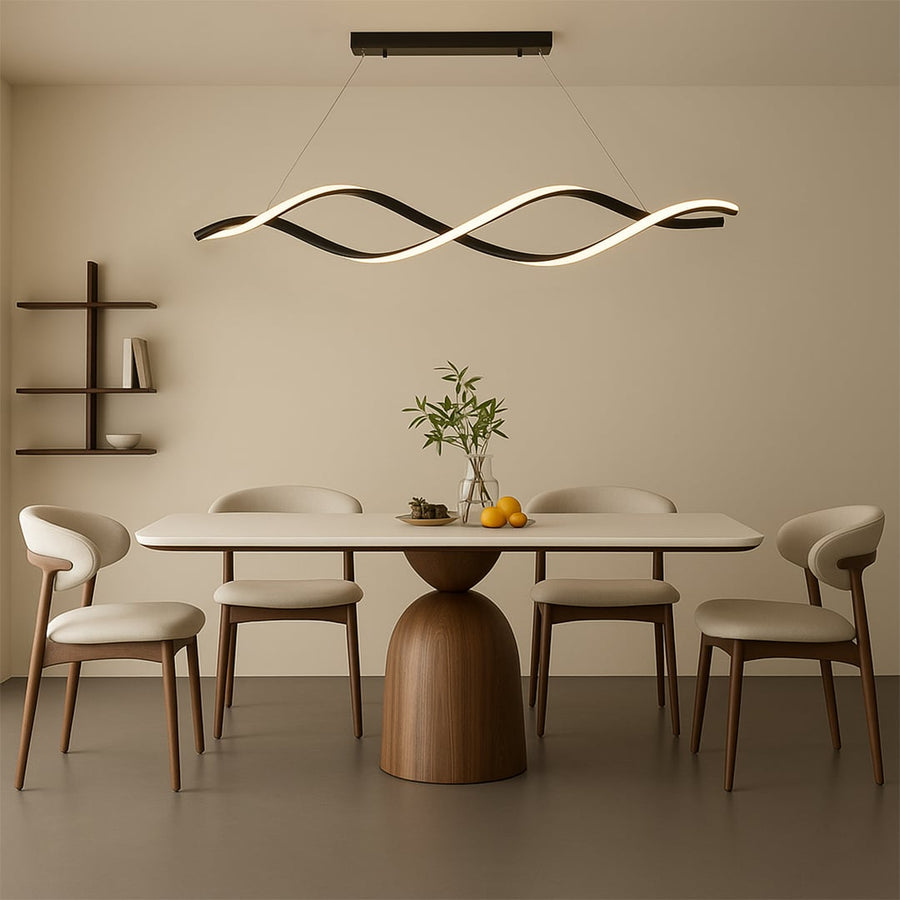 Modern chandelier displayed in a bright lifestyle setting highlighting its flowing wave-shaped frame and sleek suspended black finish.