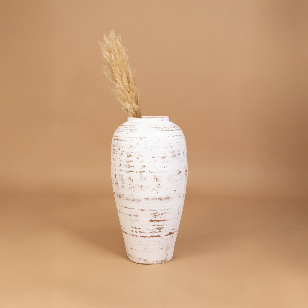 White rustic decorative vase placed in a curated room setting enhancing consoles shelves and living spaces with natural artistic decor.