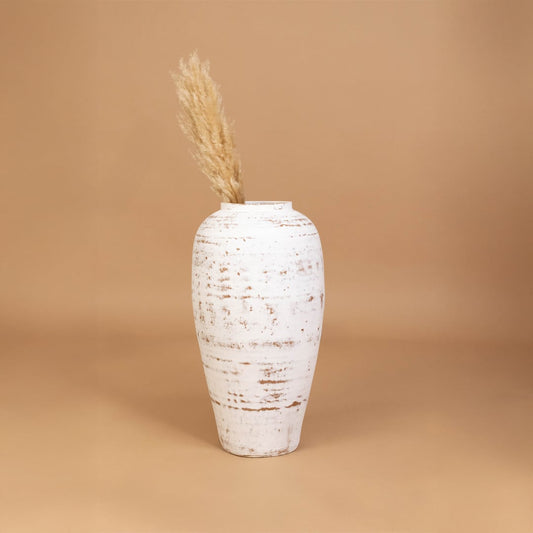 White rustic decorative vase placed in a curated room setting enhancing consoles shelves and living spaces with natural artistic decor.
