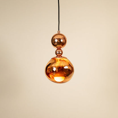 Copper metallic pendant light glowing on white background showcasing elegant design for modern home lighting.