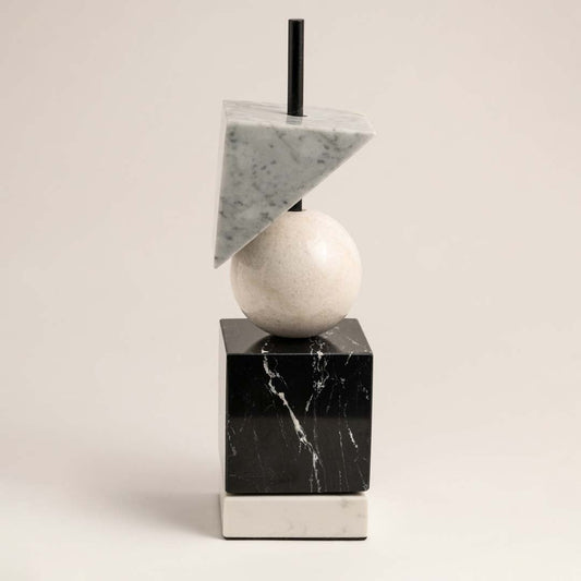 Modern marble geometric decor piece with cube sphere and triangle shapes displayed on plain white background.
