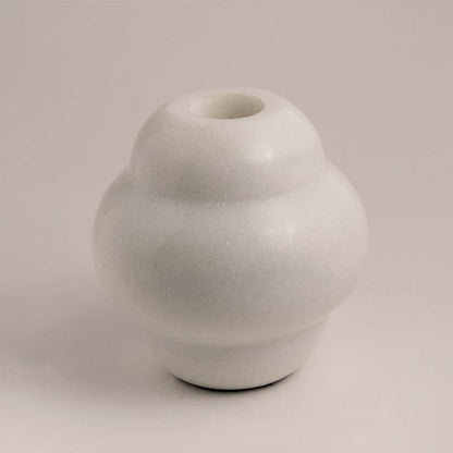 Modern ceramic vase with smooth matte white finish displayed on white background ideal for minimal shelf and table decor.