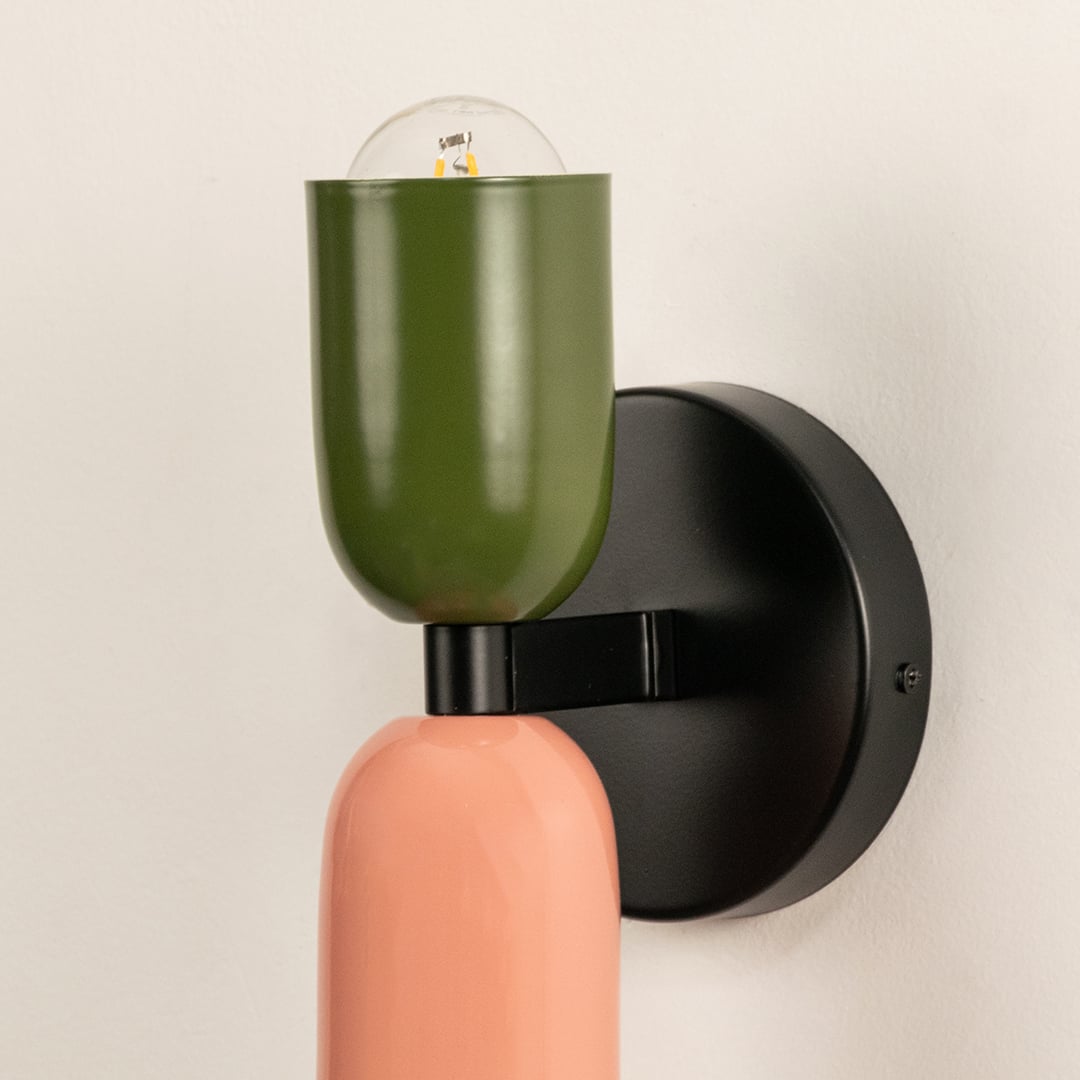 Closeup of modern wall light showing detailed craftsmanship and matte dual-tone shades.