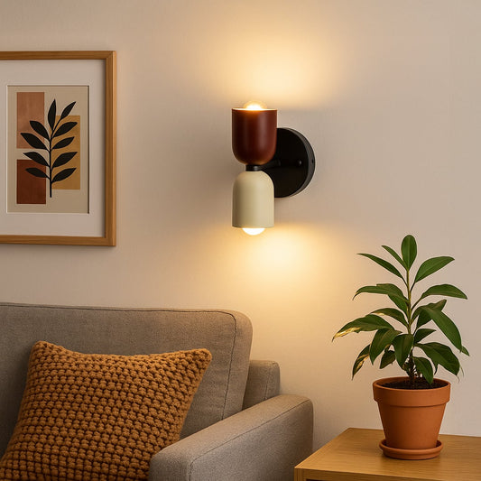 Red and cream wall sconce glowing softly beside bed adding warmth and artistic charm to modern home interiors.