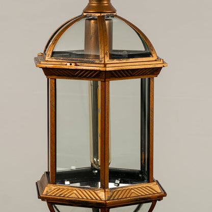 Detailed look at the ornate leaf patterns and frosted glass texture of the antique gold vintage style hanging lantern lamp.