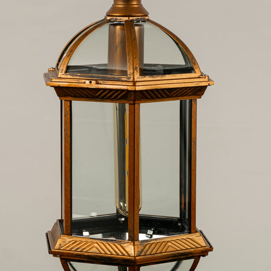 Detailed look at the ornate leaf patterns and frosted glass texture of the antique gold vintage style hanging lantern lamp.