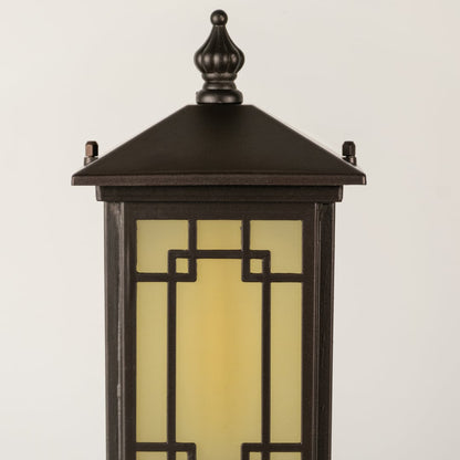 Black outdoor lantern Closeup seeded glass Light On showing warm glow and decorative pebbled glass panels.