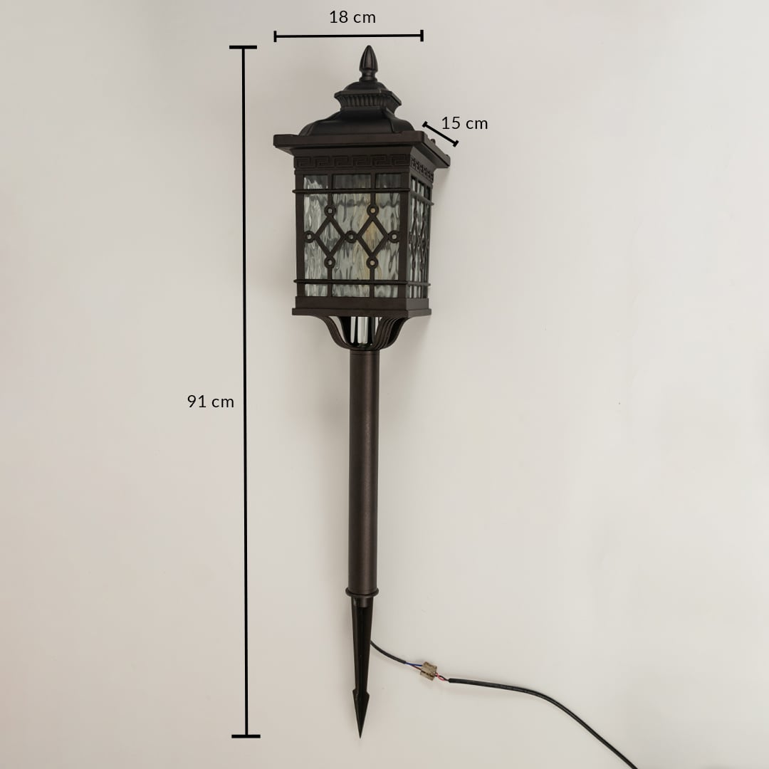 Black metal garden spike lantern with patterned glass shown with 91 cm height 18 cm width and 15 cm depth providing accurate installation measurements.