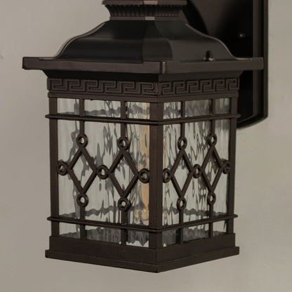 Close view of the outdoor wall lantern showcasing the detailed glass texture and elegant metal craftsmanship.