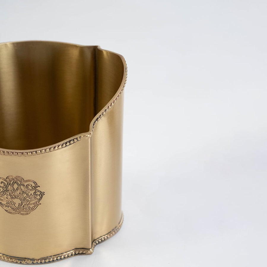 Gold pen holder set neatly packed inside a black gift box with the lid open shown on a white background.