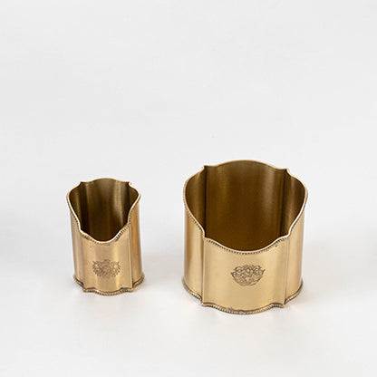 Decorative metal bucket set in gold finish with engraved design for dining table or serving decor accessory placement white background.