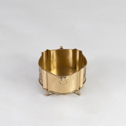 Premium gold brass planter with elegant design packed inside luxury black gift box with gold branding.