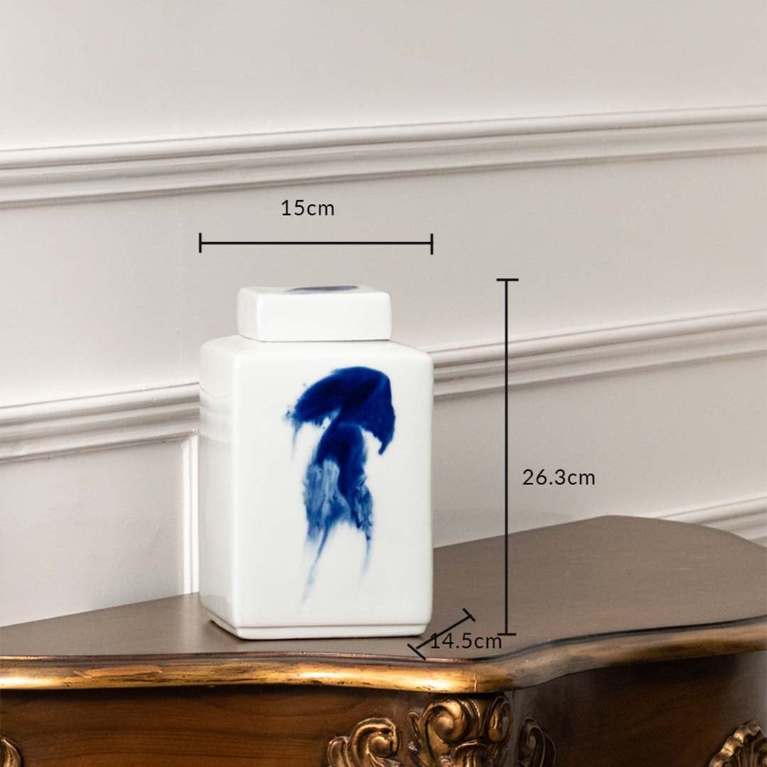 White ceramic jar with blue brushstroke artwork shown with dimensions 13 cm width and 26.5 cm height for décor detail.