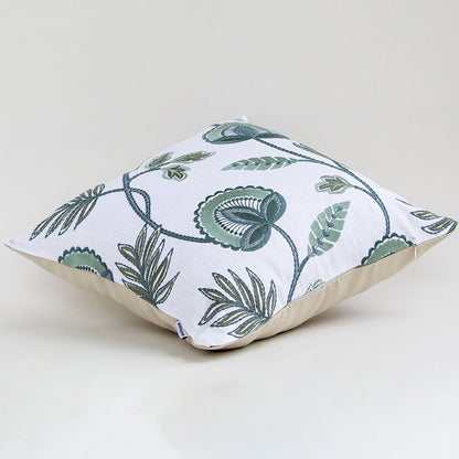 Alternate side view of the floral embroidered cushion showing its smooth edges and raised embroidery details.