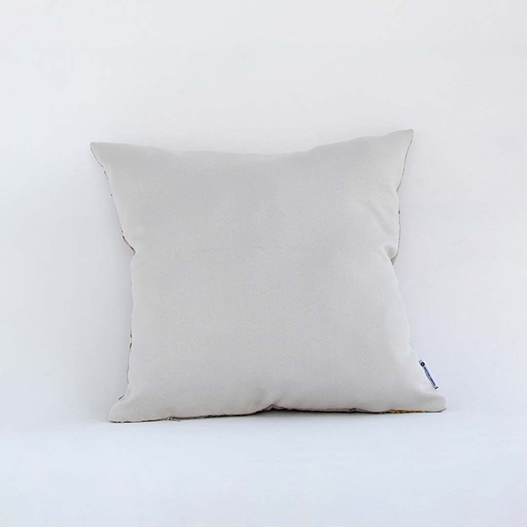 Side view of the floral embroidered cushion showcasing its filled shape and elegant stitched pattern.