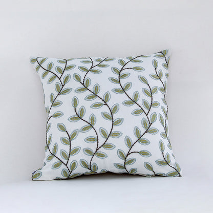 White cotton cushion cover with green botanical leaf print for sofa bedroom seating and fresh modern home decor styling.