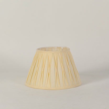 Minimal fabric lampshade in beige finish for table or floor lamp soft lighting and decor placement white background.