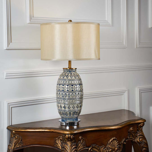 Blue and white patterned ceramic table lamp with fabric shade designed for elegant traditional decor and ambient lighting.