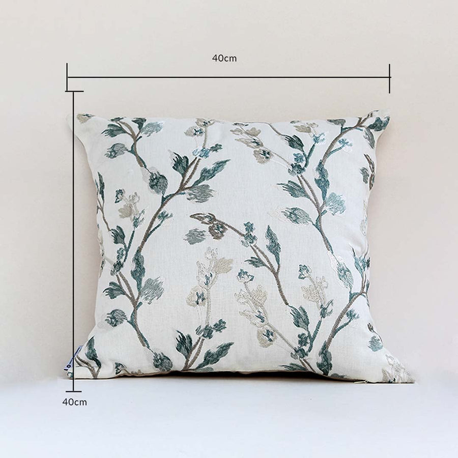 Botanical print cushion cover in teal shades presented with dimension markers confirming its 40 cm x 40 cm size helping users make correct home décor choices.