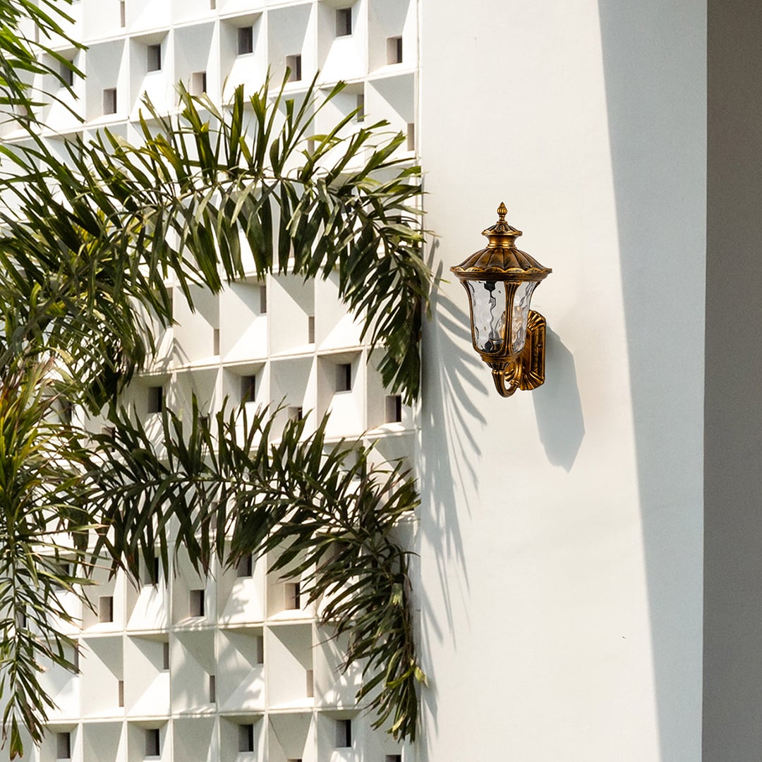 Antique gold outdoor wall lantern enhancing exterior wall ambience with classic detailing for timeless outdoor home decor.
