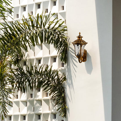 Antique gold outdoor wall lantern enhancing exterior wall ambience with classic detailing for timeless outdoor home decor.