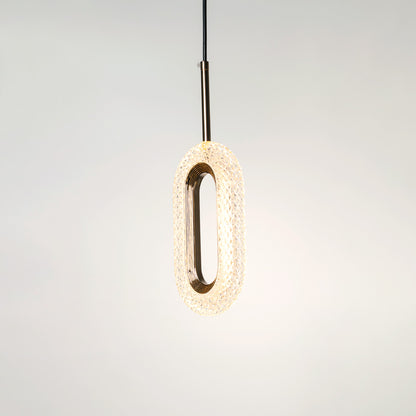 Gold metal pendant light with illuminated oval design and crystal center crafted for elegant interiors.