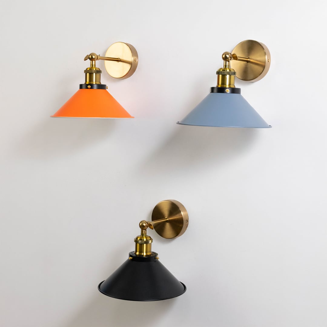 Stylish grey cone wall lamps arranged in pair showcasing symmetry and modern brass accents for designer interiors.