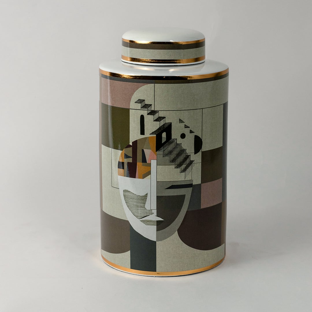 Abstract Face ceramic jar on a white background showcasing its detailed geometric art pattern and gold rim finish.