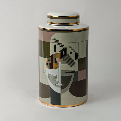 Abstract Face ceramic jar on a white background showcasing its detailed geometric art pattern and gold rim finish.