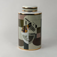 Abstract Face ceramic jar on a white background showcasing its detailed geometric art pattern and gold rim finish.