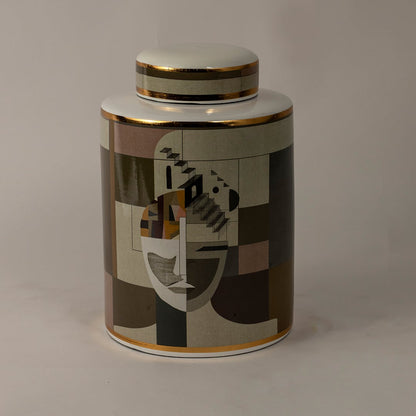 Abstract Face ceramic jar against a black background highlighting detailed geometric patterns and glossy gold trim.