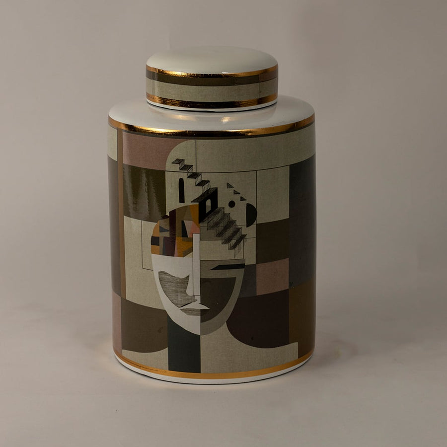 Abstract Face ceramic jar against a black background highlighting detailed geometric patterns and glossy gold trim.
