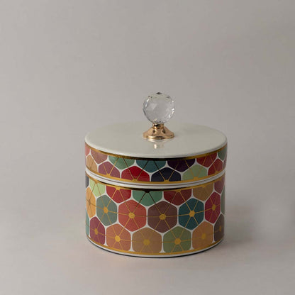 Elegant handcrafted ceramic jar with colorful geometric floral design and crystal lid accent for modern interiors.