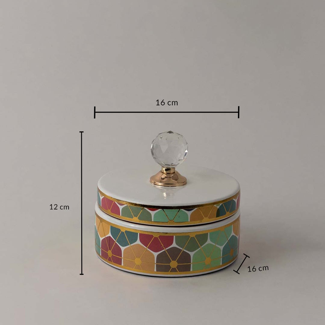 Decorative ceramic jar with geometric floral design and crystal lid shown with 12 cm height and 16 cm width size.