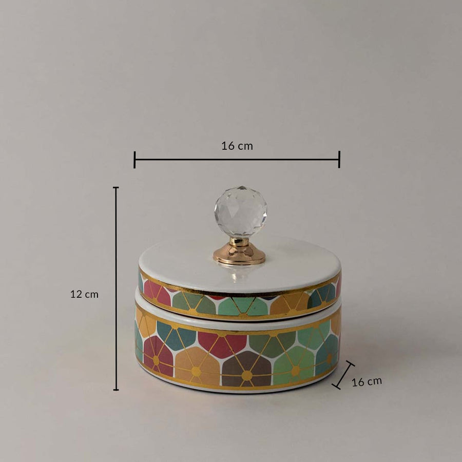 Decorative ceramic jar with geometric floral design and crystal lid shown with 12 cm height and 16 cm width size.