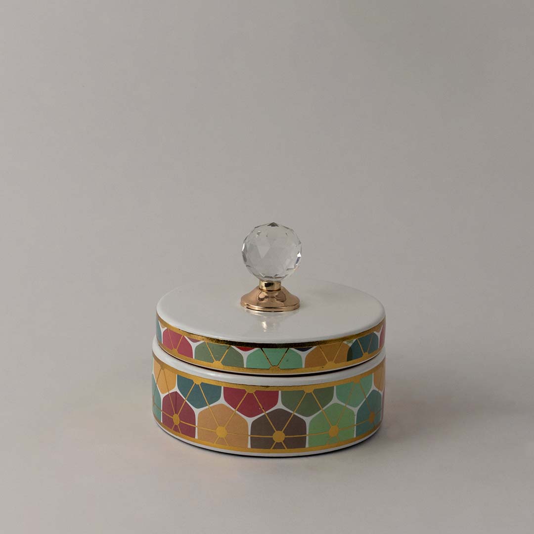 Elegant handcrafted ceramic decor jar with multicolor geometric pattern and crystal top for stylish interiors.