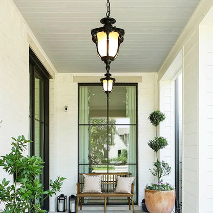 Classic hanging lantern light adding timeless elegance and inviting warmth to entryways or covered patios.