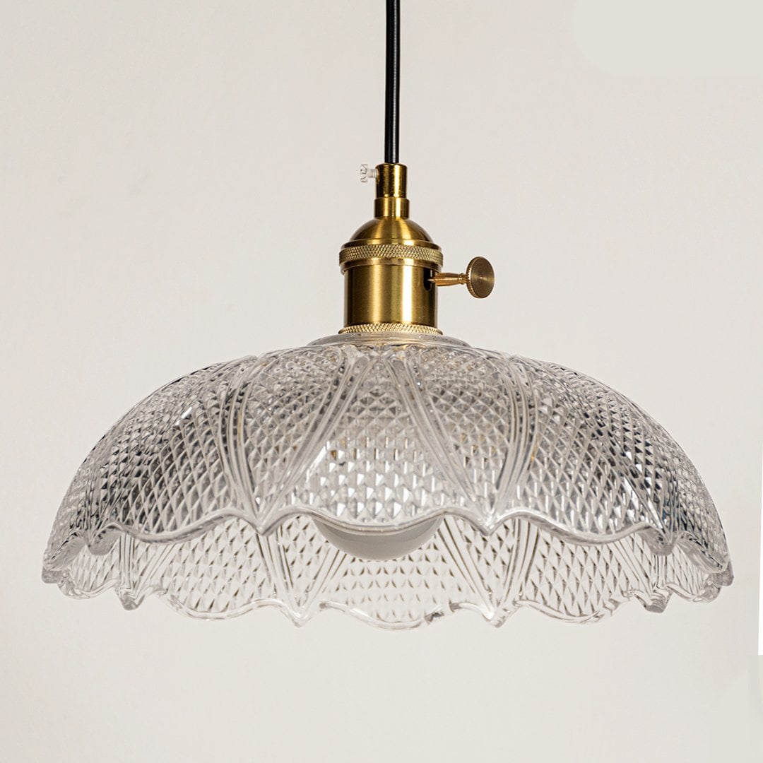 Clear textured glass pendant light with polished gold fittings crafted for kitchens and dining rooms.