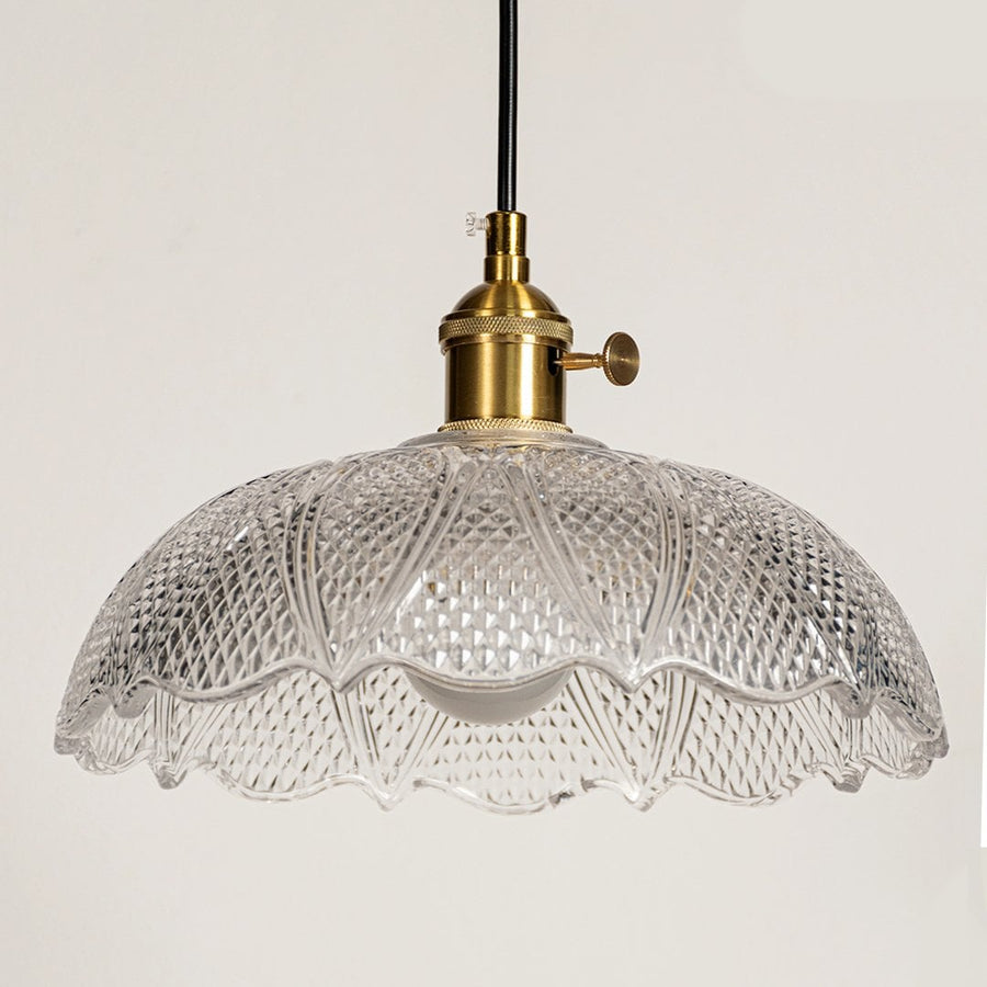 Clear textured glass pendant light with polished gold fittings crafted for kitchens and dining rooms.